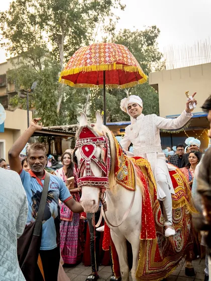 The groom's happy expression says it all. I manage the logistics of the baarat so that the groom and his family can simply enjoy the moment.