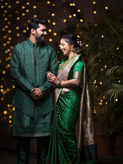 A candid moment of laughter and conversation between the couple, with a warm, glowing background.