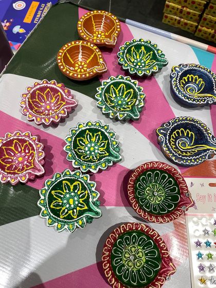 A beautiful collection of diyas painted by kids at one of my workshops. I love seeing the variety of colors and patterns they come up with. Each one is a tiny work of art.