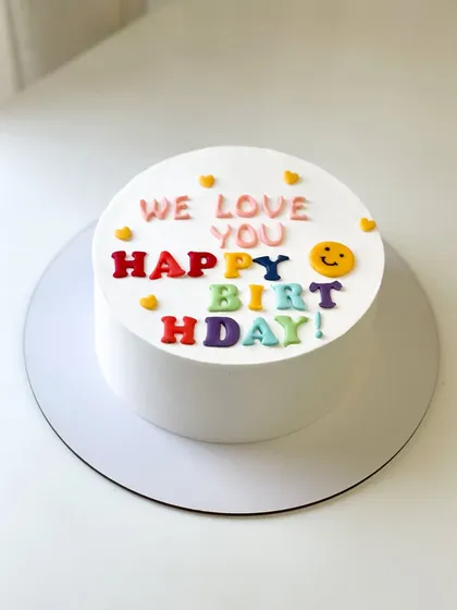 A cute and colorful birthday cake, perfect for telling dad "we love you."