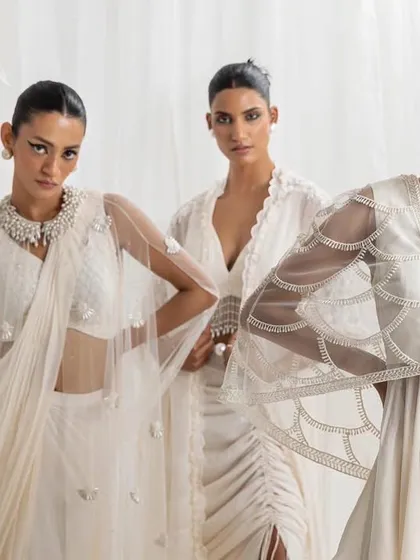 This campaign image for Seema Thukral's "Rumi" collection features three models in coordinated ethereal white outfits. The composition and styling demonstrate my ability to create a cohesive and dreamlike narrative for a full collection, focusing on delicate textures and modern silhouettes.