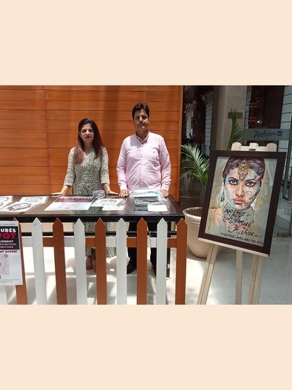 My professional stall at the Radisson Blu. I come with my own easel, table, and display art, making the setup process completely hassle-free for the event organizers.