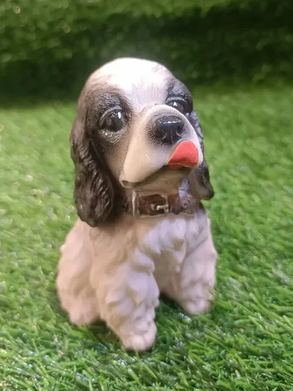 A sweet Cocker Spaniel puppy figure, another great addition for any dog enthusiast.
