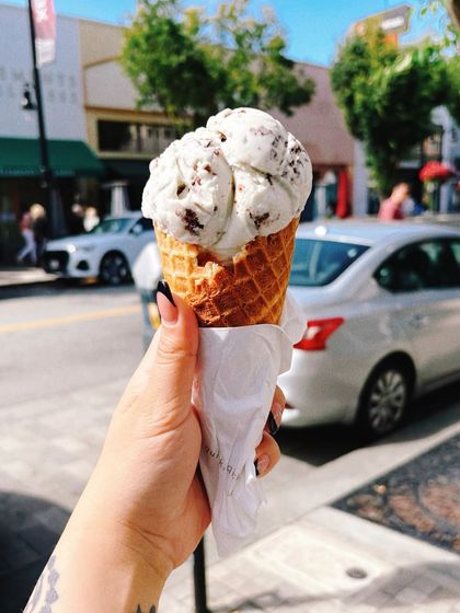 A perfect waffle cone from Salt & Straw on a sunny California afternoon. This type of content connects a food experience with a travel moment, creating an aspirational and memorable story.