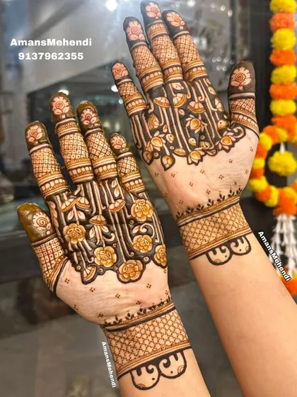 A beautiful example of a 'half-jaal' or net design on the palms, where a floral vine pattern creates a sense of fullness while still feeling light.