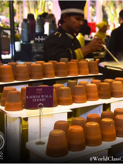 Our traditional "Kadhai Wala Doodh" station, with hot, spiced milk served in rustic clay kulhads. This comforting beverage is a perfect, nostalgic addition to any winter wedding or event.