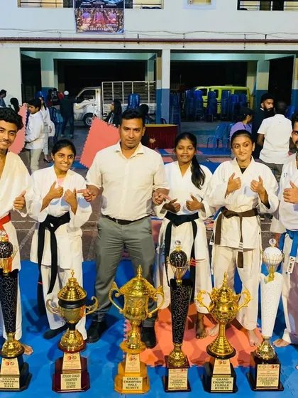 Victory is sweetest when shared. I am incredibly proud to stand with our champions and their trophies after a successful state-level inter-dojo karate championship. Their success is a testament to their relentless effort.