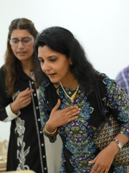 A client trying on a pearl necklace at our Delhi store. I am always on hand to offer advice and suggestions during these private appointments.