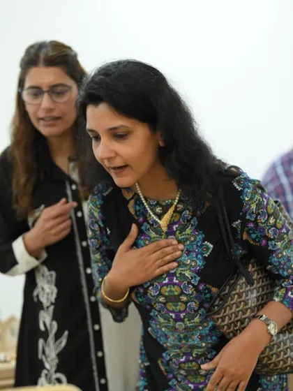 A client trying on a pearl necklace at our Delhi store. I am always on hand to offer advice and suggestions during these private appointments.