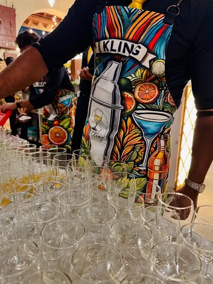Our team ready for action in their fun, custom-designed aprons. The vibrant artwork reflects our creative and colorful approach to bar service, combining professionalism with a touch of personality.