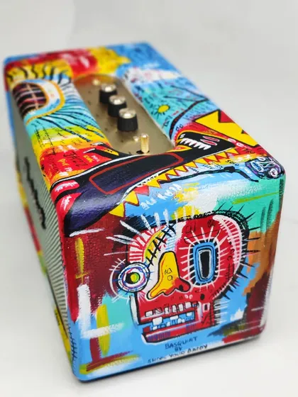 This angle highlights the iconic skull motif from Basquiat's work, recreated by hand on the side of the Marshall speaker. The raw, expressive style is what makes this piece so powerful.
