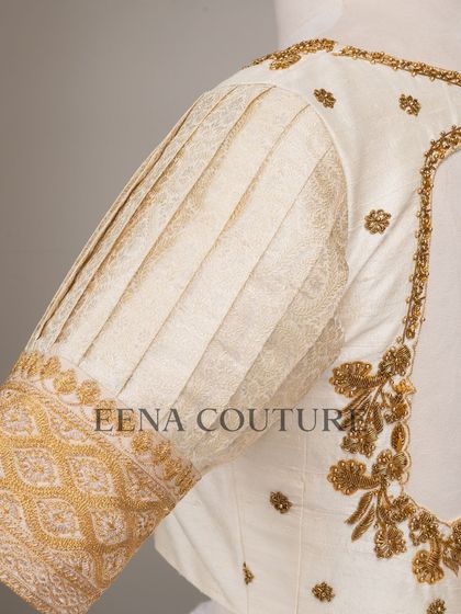 This video showcases an ivory-toned blouse with pleated puff sleeves and gold embroidery. It highlights the intricate handwork and traditional materials that go into every piece I create for my brides.