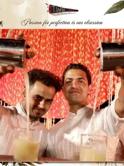 Two of our bartenders perform a synchronized dual pour, a testament to their teamwork and skill.