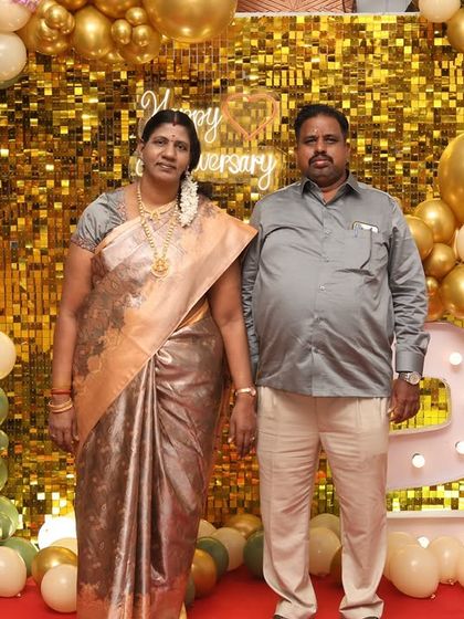 The happy couple celebrating their 25th anniversary in front of the beautiful decor we designed for them. It's a joy to be part of such special family moments.