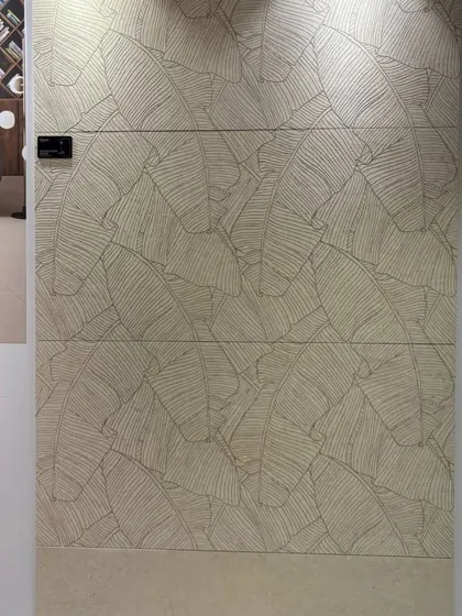 "Ab surface ko feel karo." This tile features a subtle, textured leaf pattern that invites touch, adding a tactile dimension to your walls.