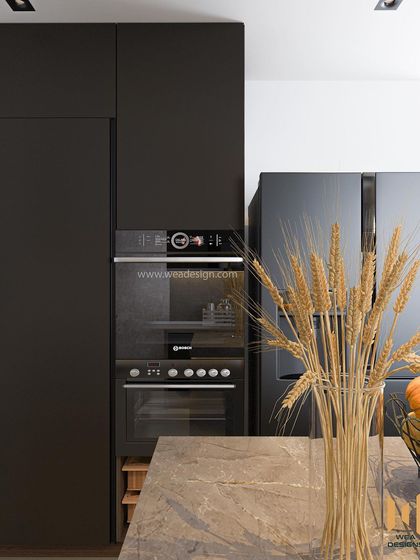 A close-up of the tall unit with a built-in oven, showcasing the sleek, handleless design of the dark cabinetry.