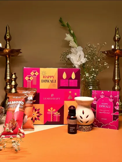 This festive hamper combines a ceramic diffuser with essential oil and healthy chocolate bars, offering a gift of relaxation and wellness for Diwali.