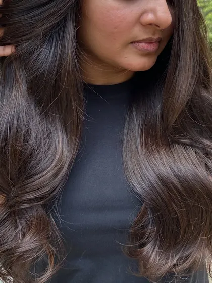 Her first hair color, and we went with a beautiful 'Cocoa Bean' shade. This is a great choice for a first-timer, as it's a subtle, rich brown that enhances natural hair color without being too dramatic.