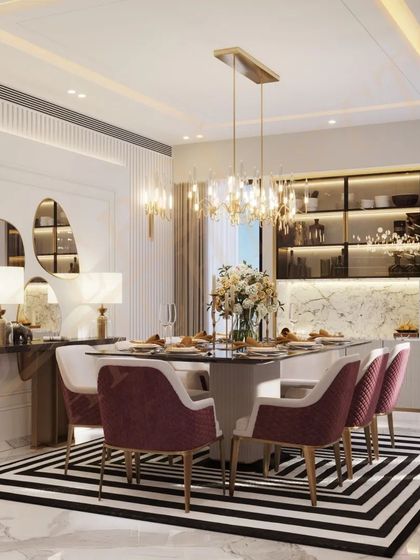 Elevate your dining experience with a touch of elegance. This space features a bold black-and-white striped rug, plush pink chairs, and a stunning chandelier.