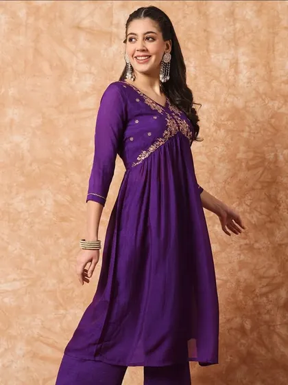 A wine-colored kurta pant set with a flattering A-line silhouette. The thread embroidery on the yoke adds a beautiful detail.