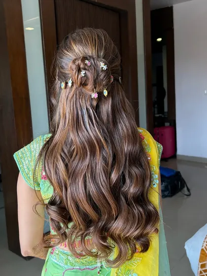 This unique Haldi hairstyle is perfect for a bride who wants something creative and memorable for her pre-wedding functions.