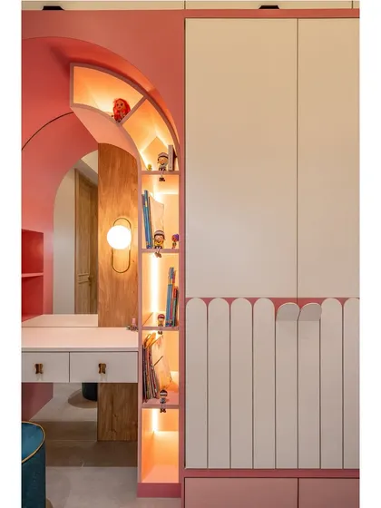 A close-up of the custom-designed vanity area. The arched niche with backlit shelving is a beautiful and practical feature for storing small items and accessories.