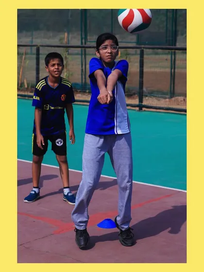 This player shows great form and focus during a passing drill. We emphasize a low stance and steady platform to control the ball effectively.
