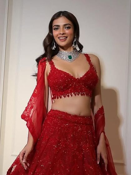 Overwhelmed with bridal jewellery decisions? This look, featuring a stunning diamond and emerald choker with a red lehenga, is a classic choice for the main ceremony.