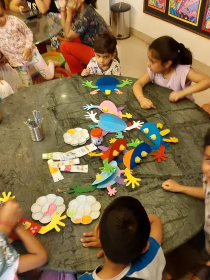 We're learning about frogs! Our youngest student, Kabir, seems to have a story to tell about his creation. The class is always full of imagination.
