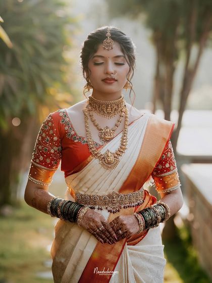 A moment of quiet reflection, with the bride's eyes closed. This serene portrait captures a sense of inner peace and anticipation.