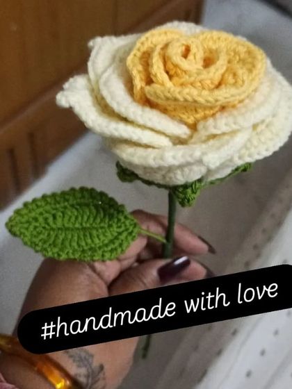 A close-up of a beautiful two-tone rose I made, with delicate white outer petals and a soft yellow center. The detailed stitching on the leaf adds a realistic touch to this everlasting flower.
