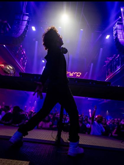 A powerful silhouette shot from a major show. This image was used for my tour announcement, capturing the energy I bring to the stage.