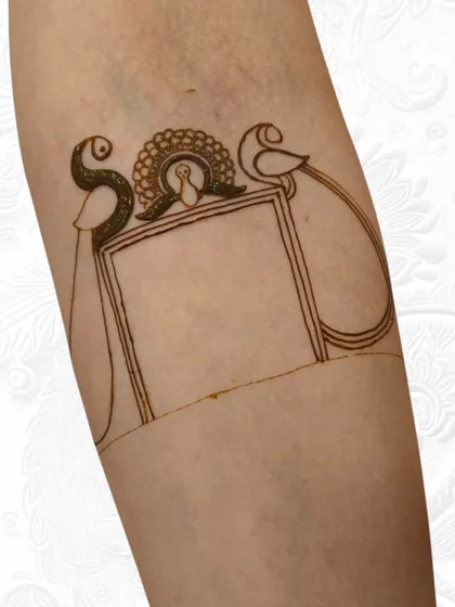 An even earlier stage of the armlet, showing just the peacock outlines.