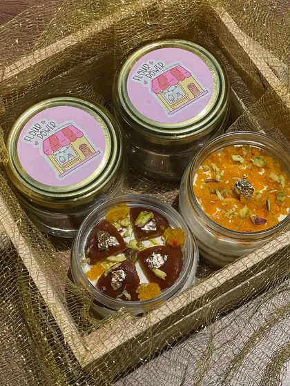 My Indian fusion dessert jars are a huge hit for Rakhi. This gift box includes flavours like Gulab Jamun Cheesecake and Motichoor Rabri, presented in a rustic wooden crate.