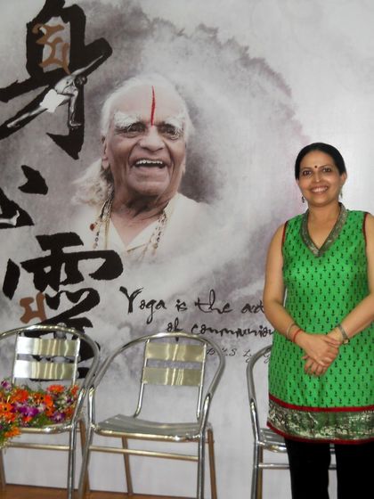 Standing before the image of my Guru, I am forever inspired by his teachings. His wisdom is the light that guides my path and the path of my students.