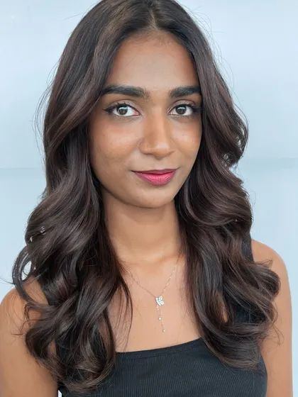 Another look at the gorgeous Matryoshka balayage, highlighting the soft, flowing waves and rich, blended tones achieved by our expert colorists.