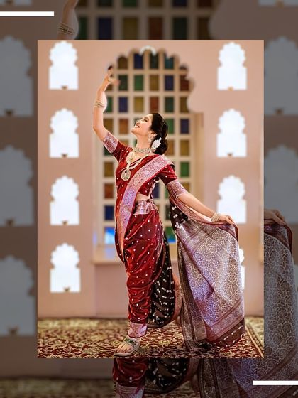 A joyful, dance-like pose in the Navari saree, showing the beauty of this traditional attire.