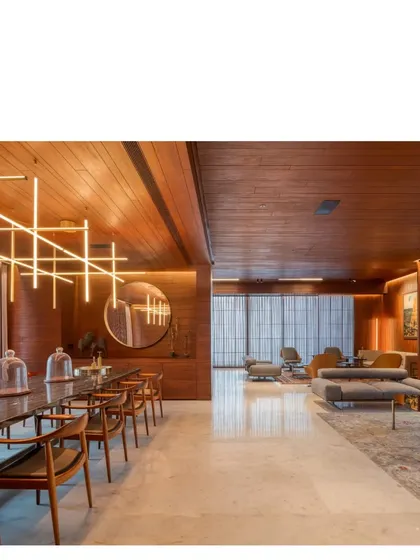 For this Bombay penthouse with ocean views, we created a warm, expansive atmosphere for family life and entertaining. The space is a testament to our belief in using all Indian materials, from Bhanswara marble to salvaged teak and a bespoke Abu Black marble dining table.