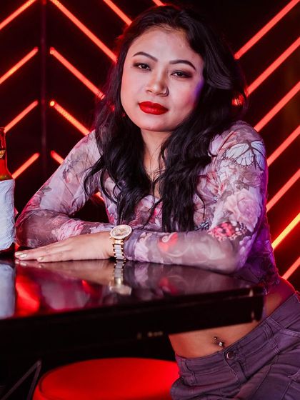 A guest posing at the bar.