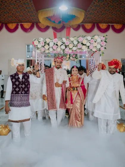The grand entrance of the bride and groom at their Maharashtrian wedding. I use effects like fog to create a dreamy and dramatic atmosphere for this important moment.