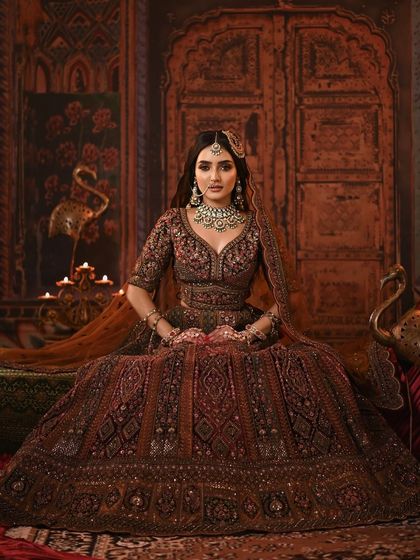 A direct, powerful portrait of the model, her makeup looking flawless and her gaze intense.