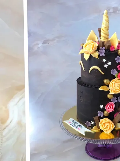 A full view of the elegant black unicorn cake against a clean background.