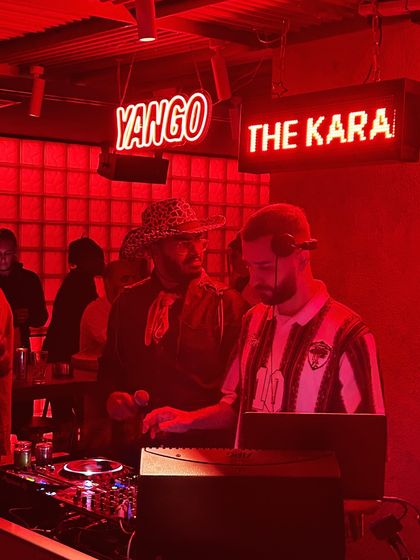 In the booth at a club in Dubai, with the red lights setting the mood. I adapt my sound to fit the venue, from underground clubs to slick city bars.