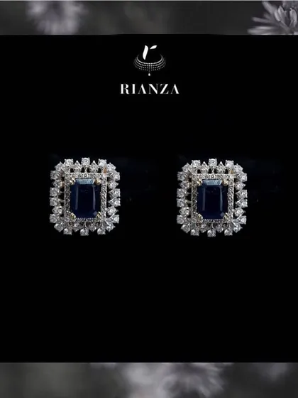 The changeable earrings shown with a deep blue sapphire. This demonstrates how one pair of earrings can be adapted for four completely different looks and color schemes.
