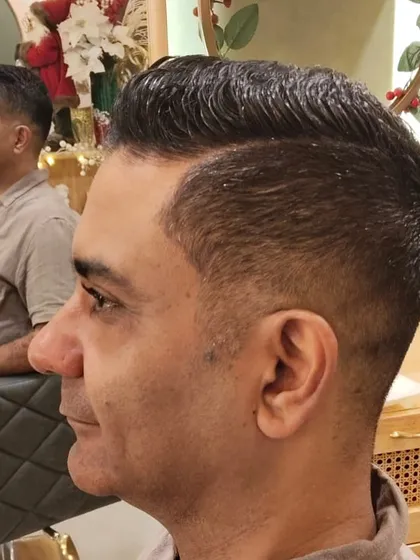 The final result of a precision haircut. I focus on the details, whether you want a modern fade or a timeless classic style, to create a look that is sharp, clean, and tailored to you.