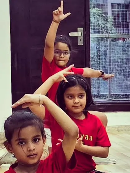 Our youngest students in their Trikayaa t-shirts, posing during a fun Bollywood session. Dance is also about joy, expression, and making friends.