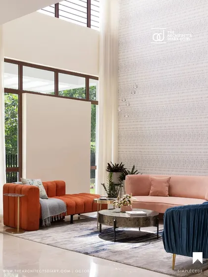 This double-height living room from 'A Walk in the Clouds' features pastel-colored sofas that add softness to the grand space.