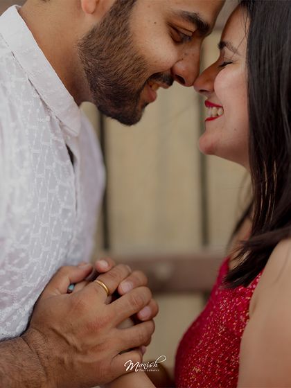 A close-up of the couple sharing an intimate, happy moment, their smiles telling a story of pure love.