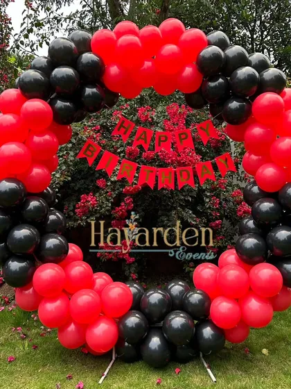 Another angle of the red and black outdoor balloon ring, showing its vibrant contrast with the background.