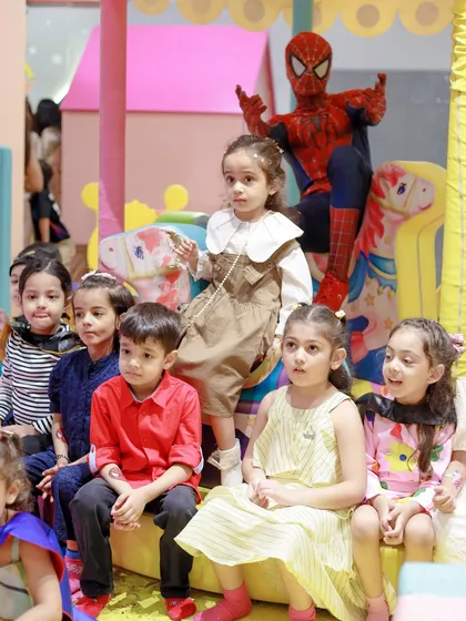 All the little heroes gather for a group photo with their friendly neighborhood Spider-Man. Our play area provides great spots for memorable pictures with our character performers.
